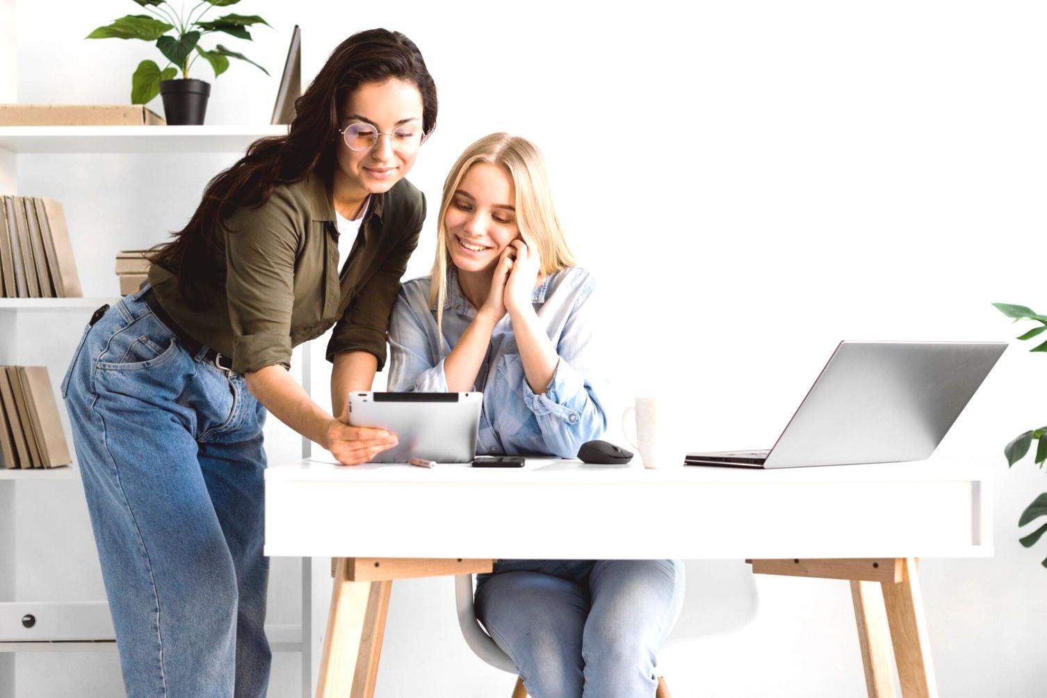 Students collaborating on economic planning exercises in workshop setting